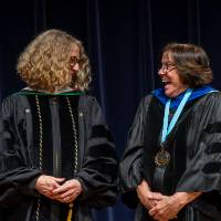 Faculty sharing a laugh